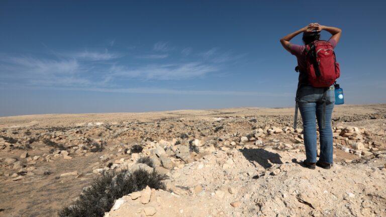 woman standing in the desert